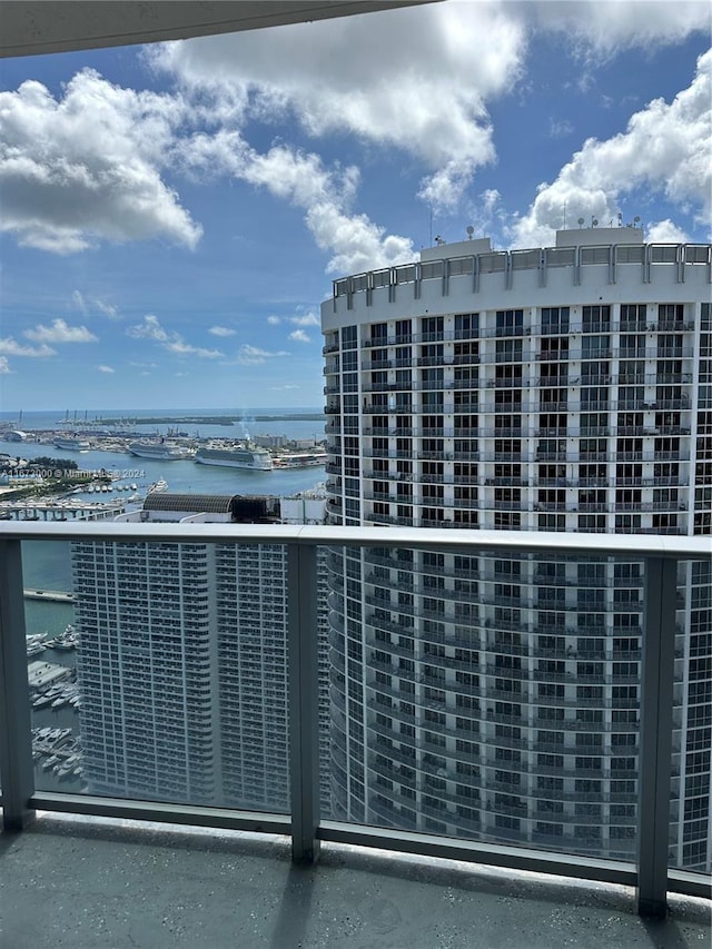 balcony featuring a water view