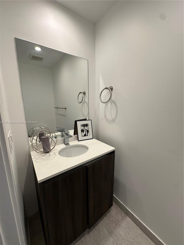 bathroom with vanity and tile patterned floors