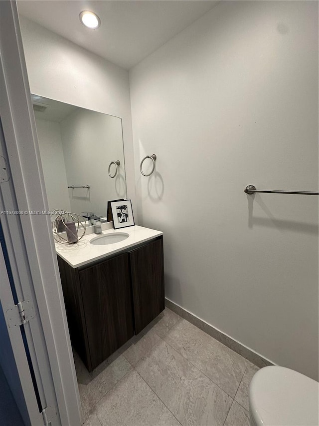 bathroom with vanity and toilet