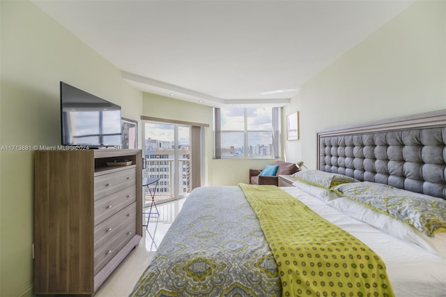 tiled bedroom featuring access to outside