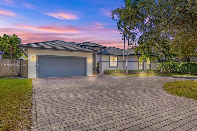 single story home featuring a garage