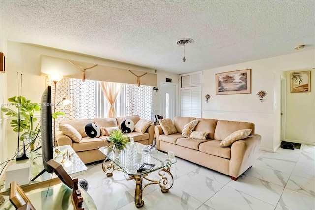 living room featuring a textured ceiling