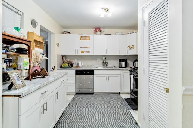 kitchen with white cabinets, electric range, stainless steel dishwasher, and sink