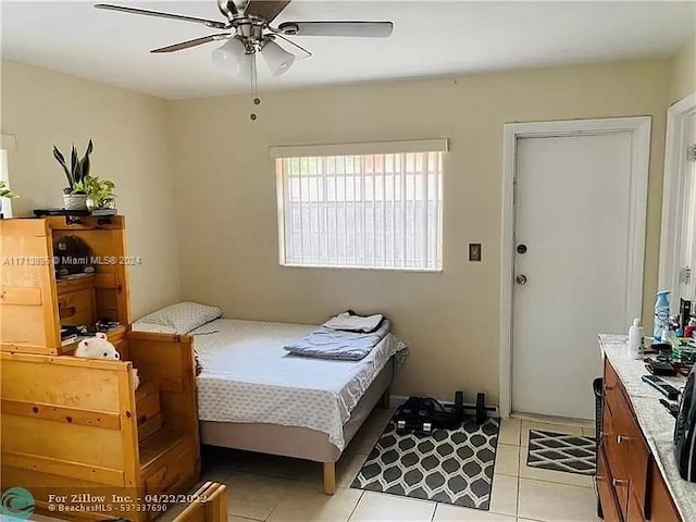 bedroom featuring ceiling fan and light tile patterned floors