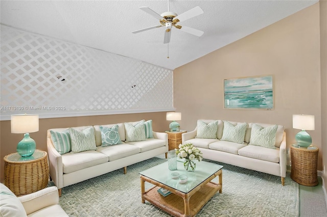 living room featuring ceiling fan, carpet flooring, vaulted ceiling, and a textured ceiling