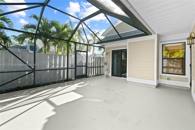 view of patio / terrace featuring glass enclosure