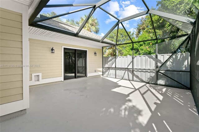 view of side of home with cooling unit and glass enclosure