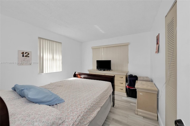 bedroom with a textured ceiling