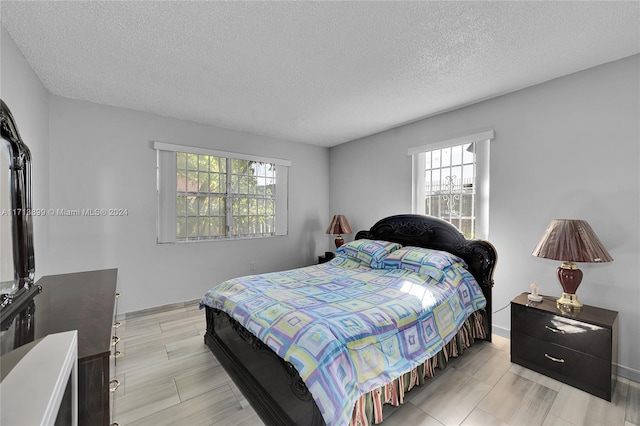 bedroom featuring a textured ceiling