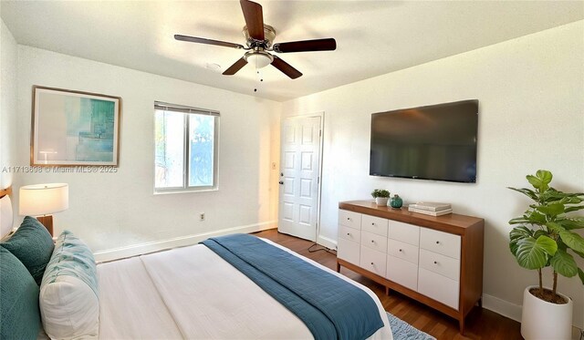 bedroom featuring ceiling fan and dark hardwood / wood-style flooring