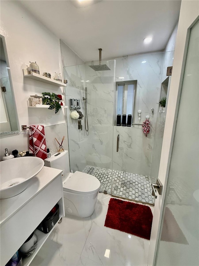 bathroom featuring walk in shower, vanity, and toilet