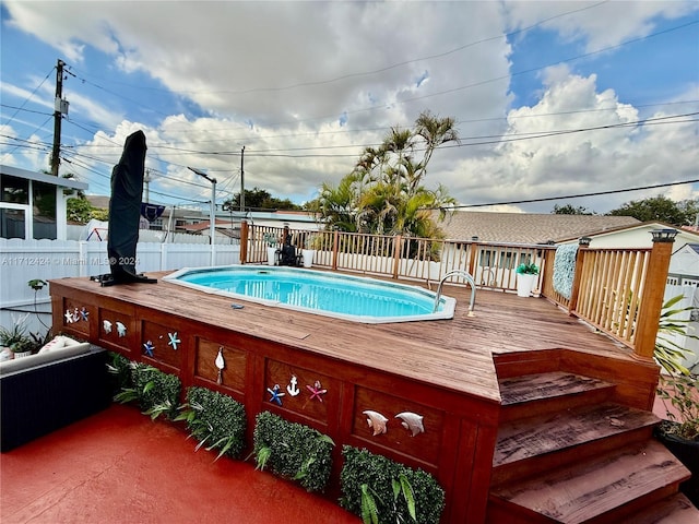 view of pool featuring a wooden deck