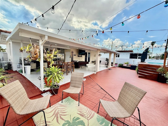 view of patio / terrace featuring an outdoor living space, cooling unit, and exterior bar