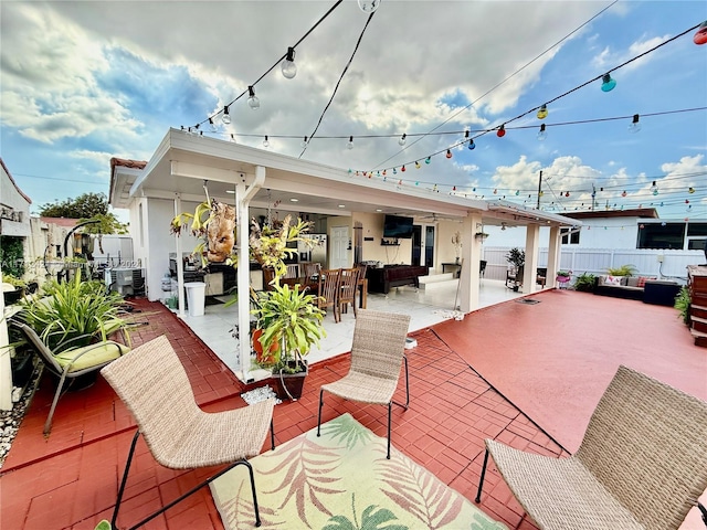 view of patio featuring exterior bar, an outdoor kitchen, and an outdoor hangout area