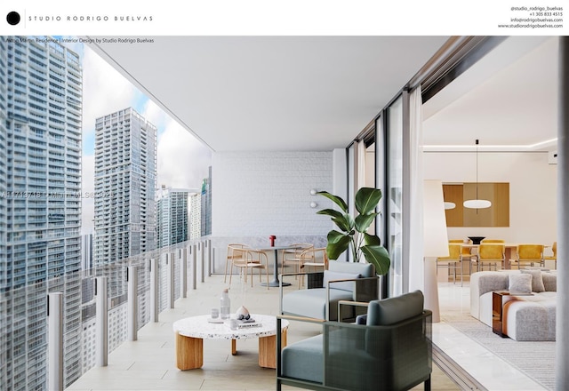 balcony featuring outdoor dining area and a city view