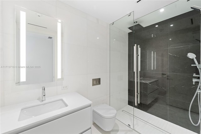 full bathroom featuring tile walls, a shower stall, toilet, and vanity