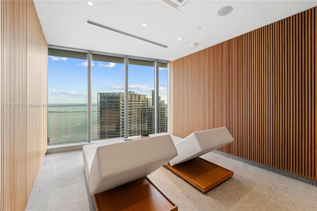 interior space with a wall of windows and a city view