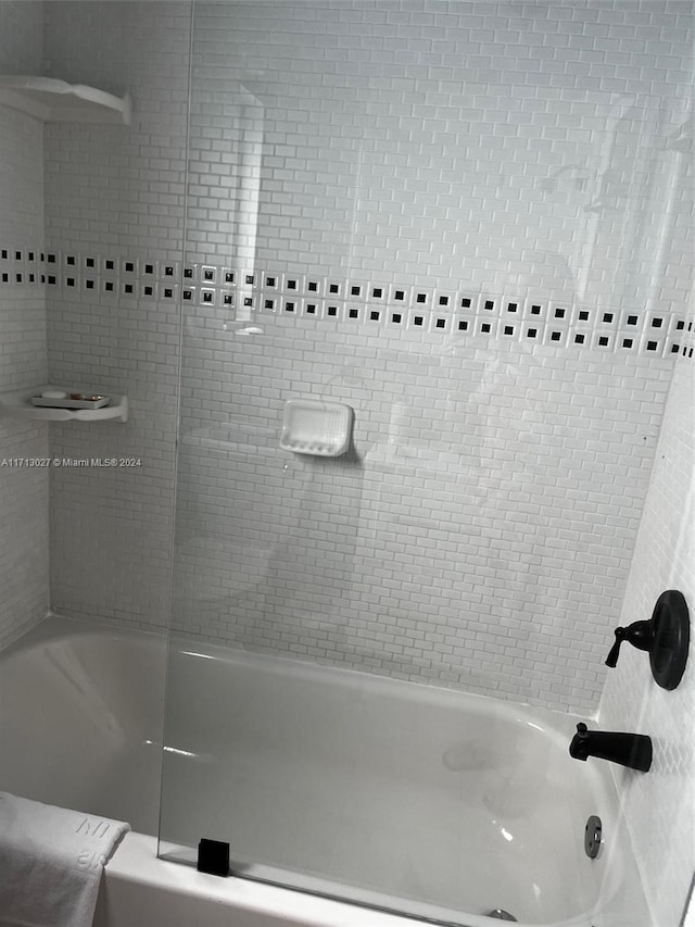 bathroom featuring washtub / shower combination