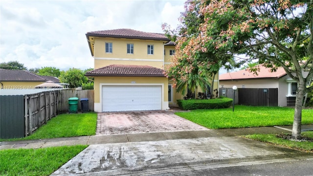 view of front of home featuring a garage and a front lawn