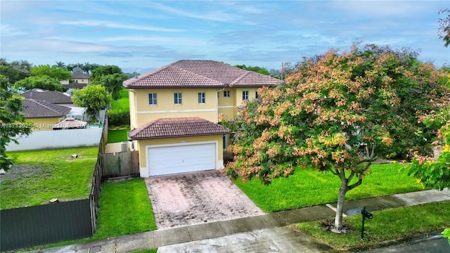 view of front facade with a front yard and a garage