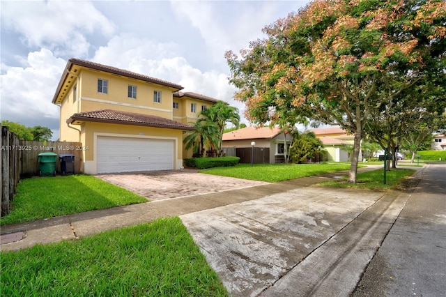 view of front of house featuring a front yard and a garage