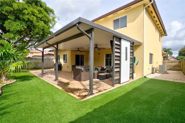 back of house featuring an outdoor hangout area, central air condition unit, ceiling fan, a patio area, and a yard