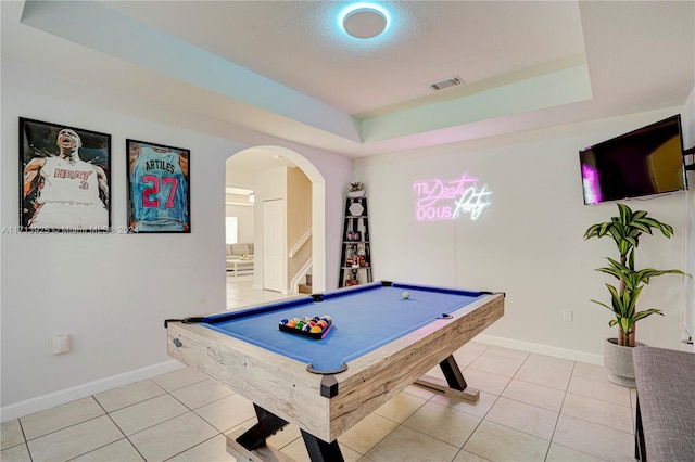 playroom with light tile patterned flooring, a tray ceiling, and billiards