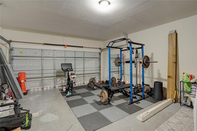 exercise room with a textured ceiling