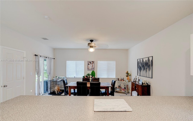 dining room featuring ceiling fan