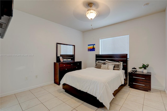 bedroom featuring ceiling fan and light tile patterned flooring