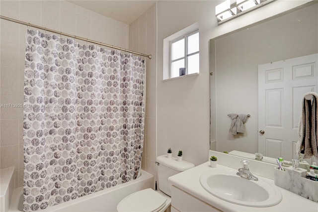 full bathroom featuring shower / tub combo, vanity, and toilet