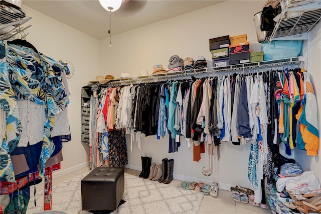 spacious closet with tile patterned floors