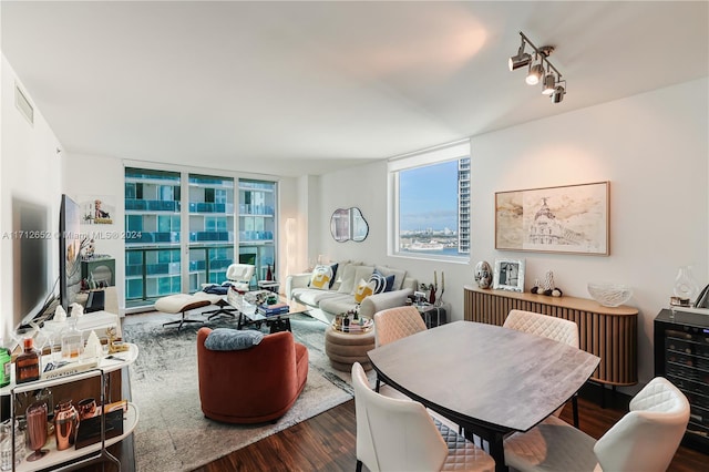 interior space featuring floor to ceiling windows, dark hardwood / wood-style floors, and wine cooler