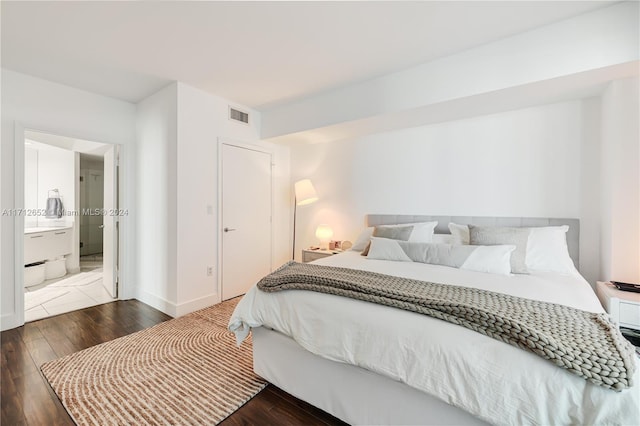 bedroom with hardwood / wood-style floors