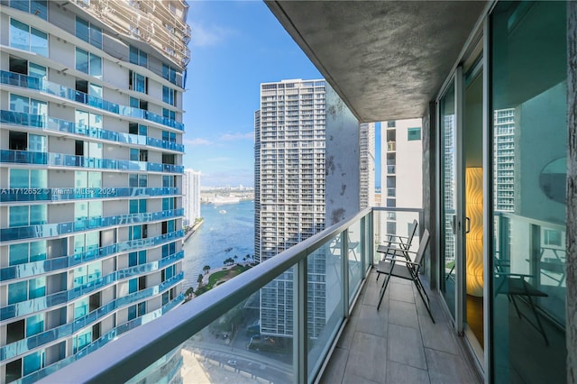 balcony featuring a water view