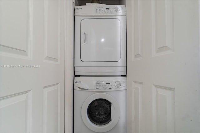 laundry area with stacked washer / dryer