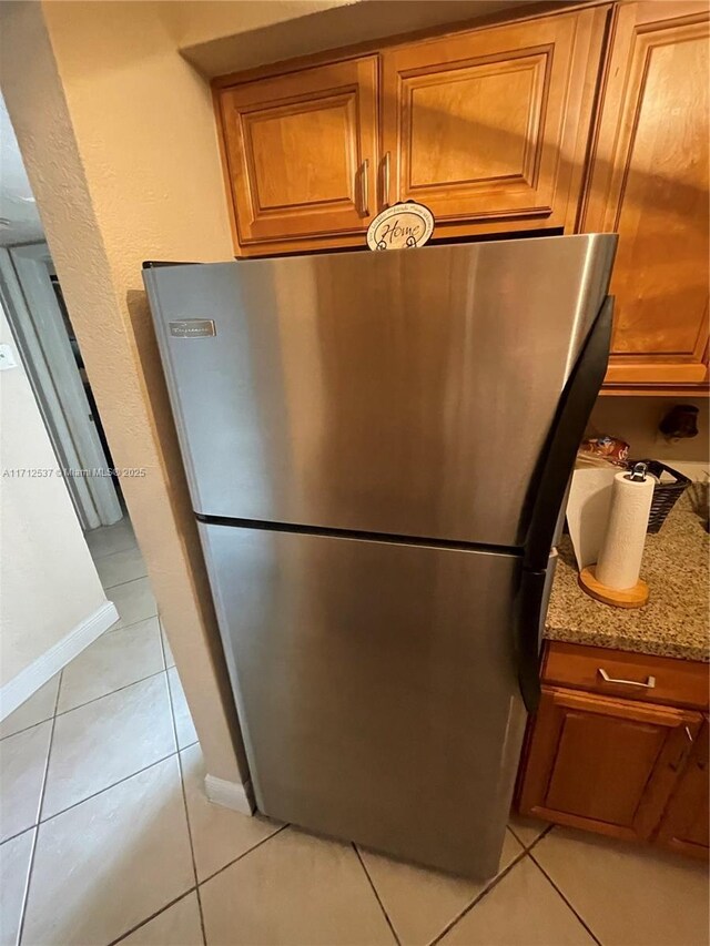 details with stainless steel fridge and light stone counters