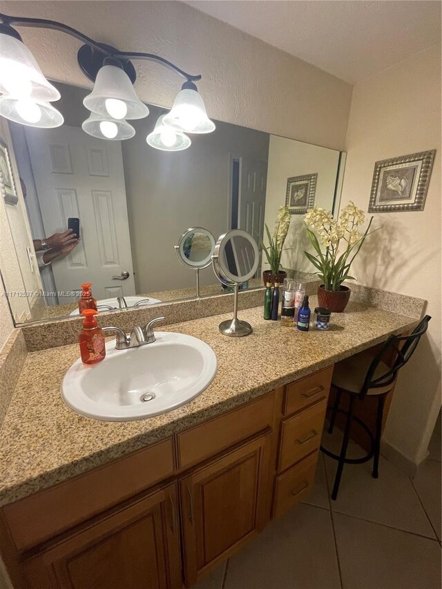 bathroom with vanity and tile patterned floors