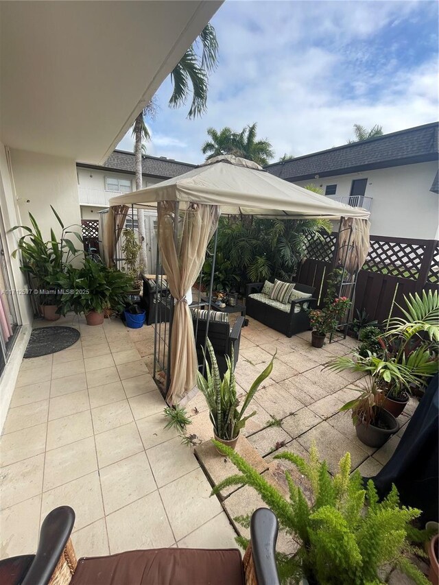 view of patio featuring a gazebo and an outdoor living space