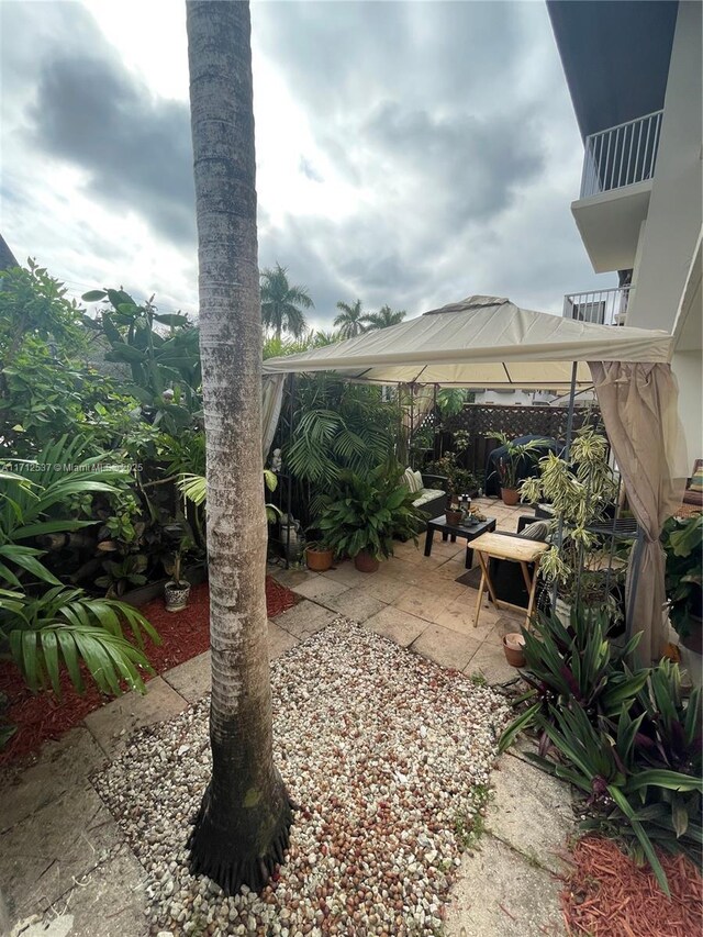 view of yard featuring a gazebo and a patio area