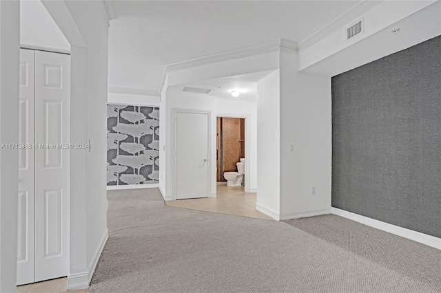 carpeted spare room with crown molding