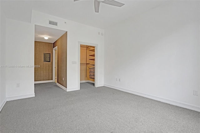 carpeted empty room with ceiling fan