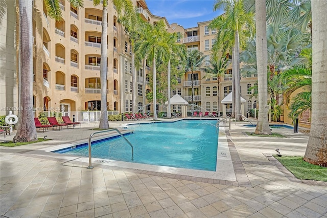 view of swimming pool featuring a patio area