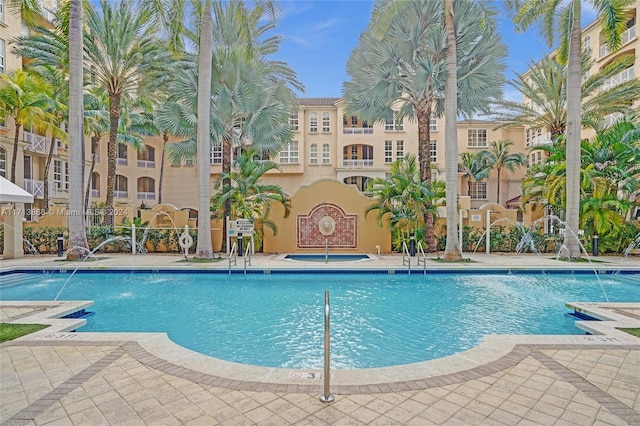 view of pool featuring pool water feature