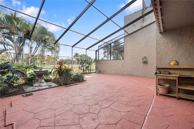 view of patio / terrace featuring glass enclosure