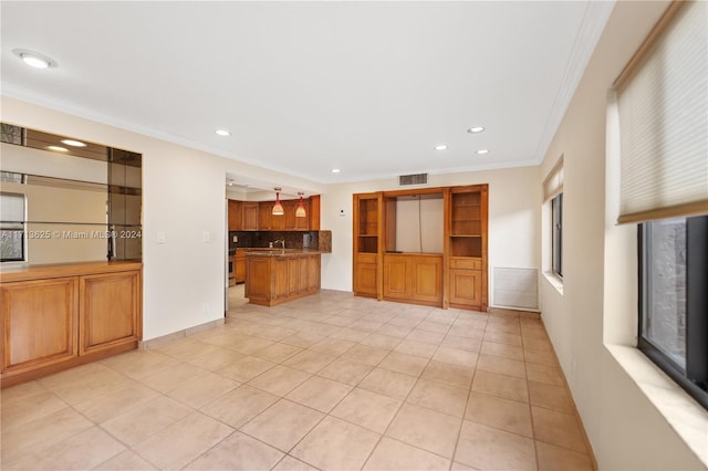 unfurnished living room with ornamental molding and light tile patterned flooring