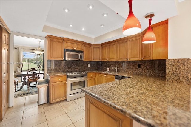 kitchen featuring pendant lighting, backsplash, light tile patterned floors, ornamental molding, and appliances with stainless steel finishes