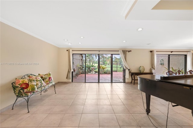 playroom featuring crown molding and light tile patterned flooring