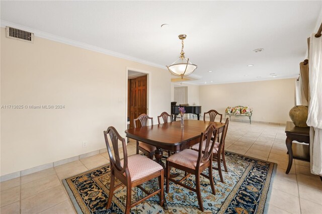 tiled dining area with ornamental molding