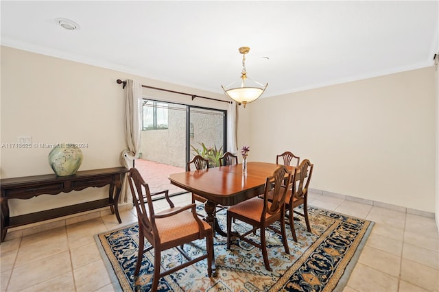 tiled dining room with crown molding